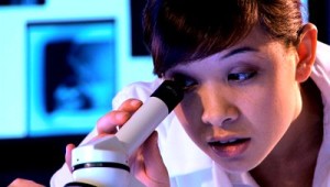 stock-footage-young-western-oriental-medical-student-using-a-microscope